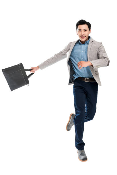 istock Happy bouncing youth business man 1286271435