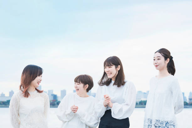 istock 4 Japanese women talking with a smile 1286274100