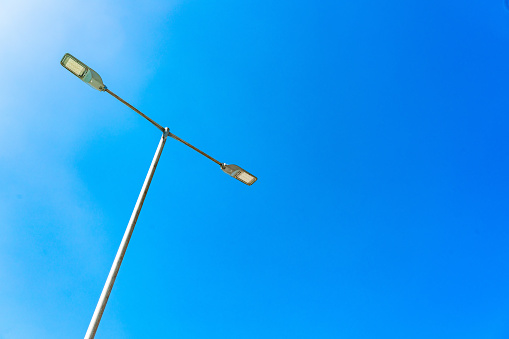 Street lamp against dark blue sky