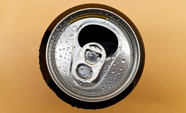 istock Top view of drink can isolated on orange background 1286275364
