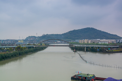 Modern outskirt area with background of bridge and residential area in Ningbo City, Zhejiang, China