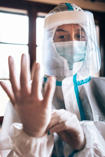 istock wearing the gloves in a contaminated site 1286279634