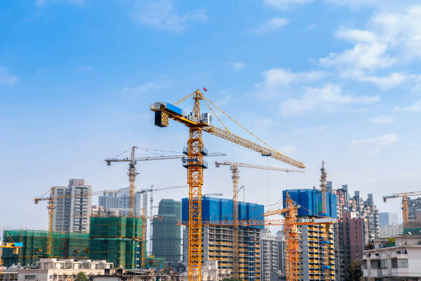 istock Construction crane on the background of the sky. Construction site. 1286279684