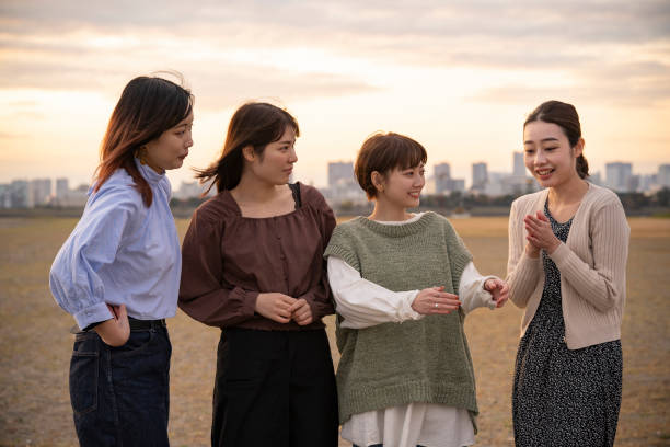 istock Four women talking happily in the dusk 1286279853
