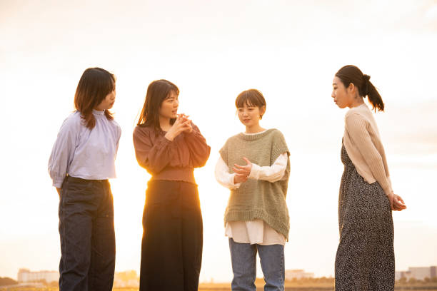 istock Four women talking happily in the dusk 1286280064