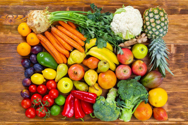 istock Fresh raw fruit and vegetable on brown wooden table 1286280137