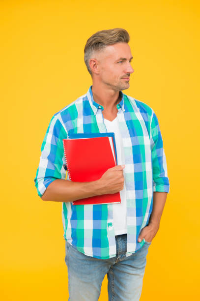 istock ready for exam test. male student portrait. handsome man enjoy study at home. home schooling concept. education and knowledge. man work as office assistant. daily schedule. Using modern technologies 1286280301