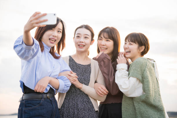 istock 4 women taking a commemorative photo 1286280304