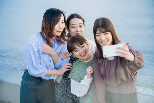 istock 4 women taking a commemorative photo 1286281009