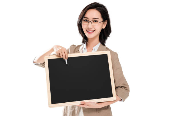 istock Young female teachers holding a blackboard 1286281218