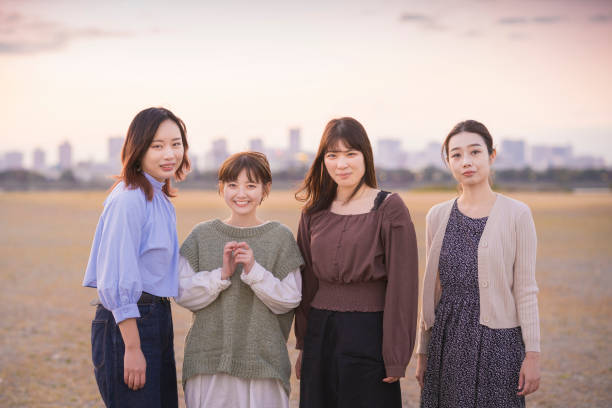 istock 4 women gathering to take a commemorative photo 1286281965