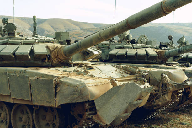 istock Russian battle tanks at tankodrome in mountains 1286284174