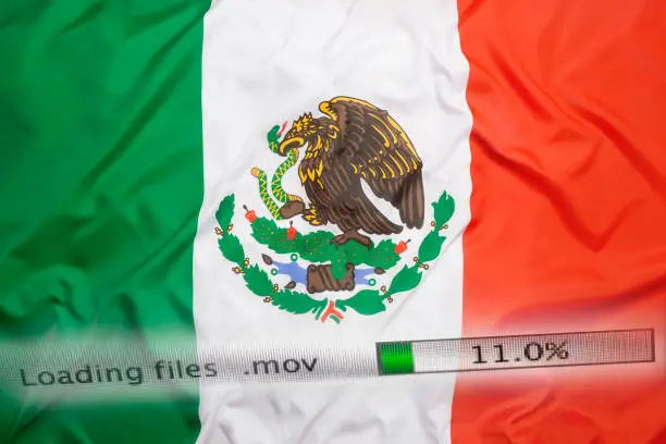 Photo of Downloading files on a computer with Mexico flag