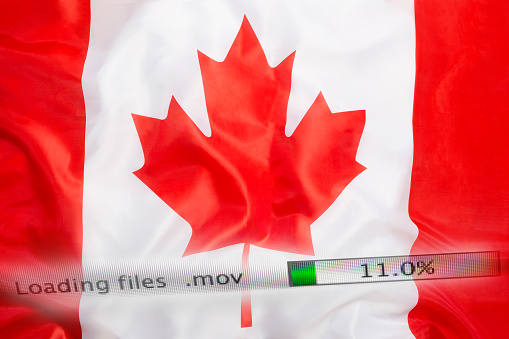 Downloading files on a computer with Canada flag