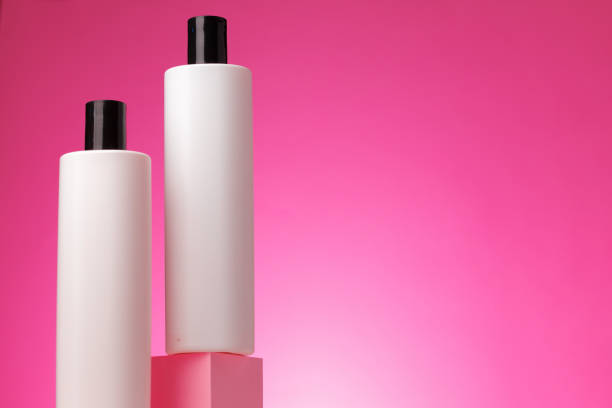 istock Blank white cosmetic container against pink background 1286284945