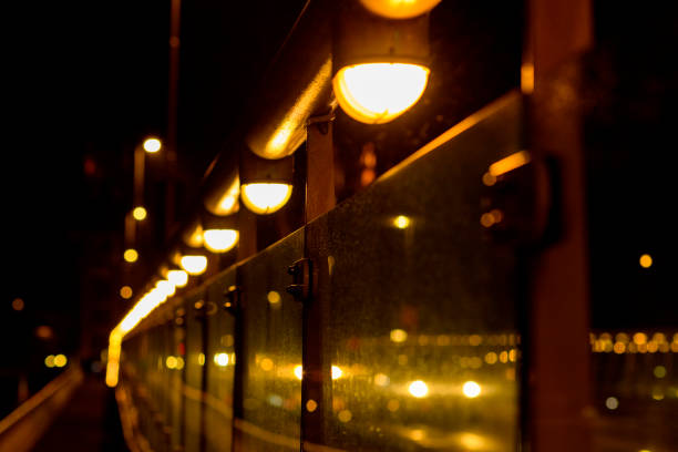 Row of defocussed lights on a bridge over the river IJssel in Kampen, The Netherlands.