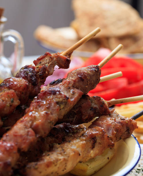 grilled meat skewers on a table, closeup view - opa! souvlaki of greece imagens e fotografias de stock