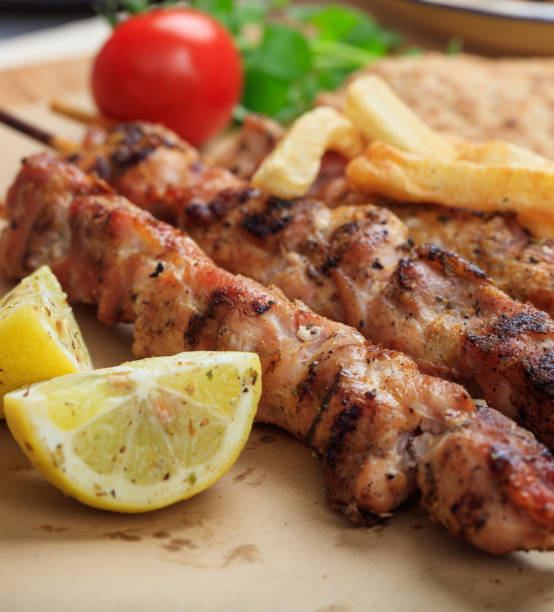 istock Grilled meat skewers on a table, closeup view 1286288577