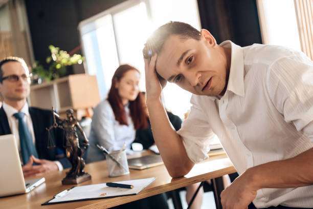 istock Puzzled man makes decision about signing marriage dissolution agreement. 1286290069