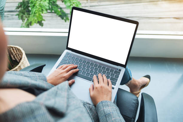 istock a businesswoman using and typing on laptop computer with blank white desktop screen in office 1286293717