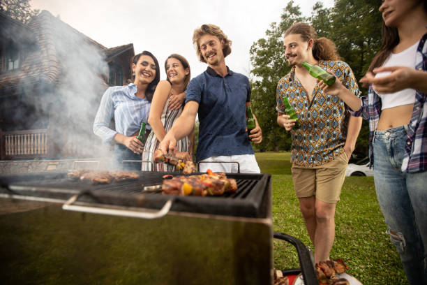 istock Young and relaxed people preparing a barbeque 1286294687