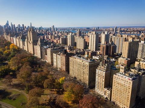 Aerial view of Manhattan from the Central Park in New York City of the United States on a clear autumn day with fall foliage