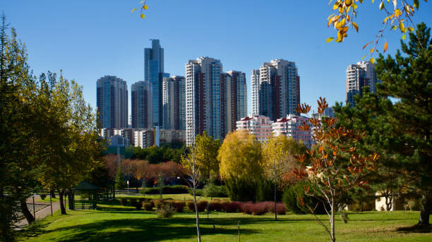 istock Autumn landscape in front of tall buildings. 1286295108