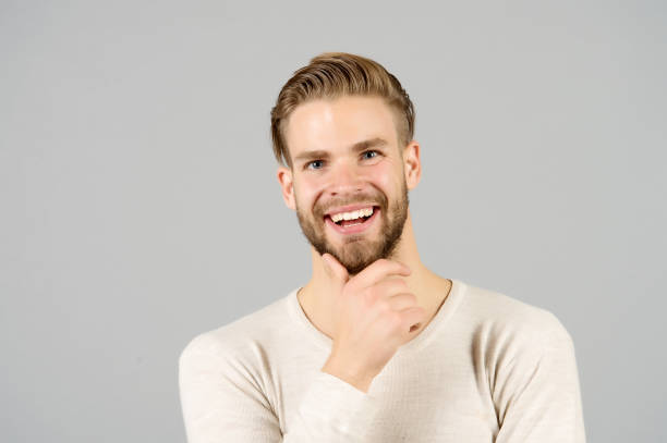 istock Happy man touch beard on unshaven face, barber 1286297361