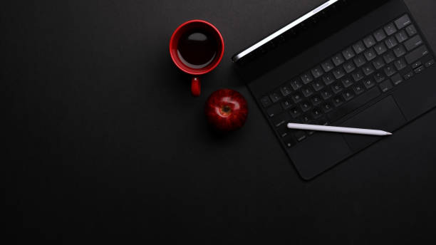 istock Workspace with tablet, keyboard, stylus, coffee mug and copy space 1286297850