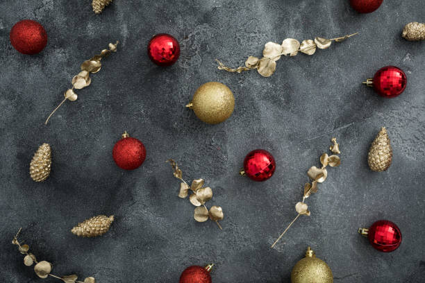 istock Christmas composition with golden branches and red decoration on dark background. Flat lay, top view 1286303712