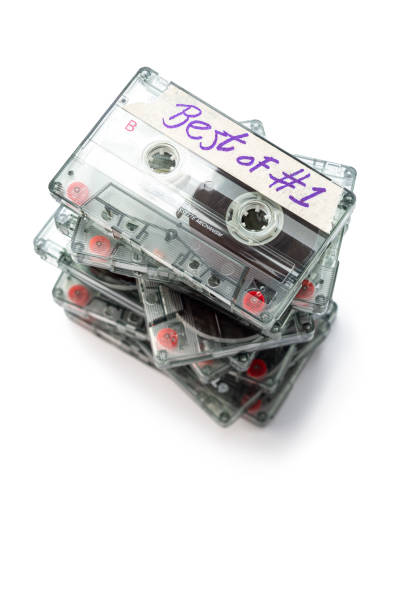 Stack of  cassette tapes, isolated on white without plastic cases.  Selective focus.Shot with a tilt shift lens.