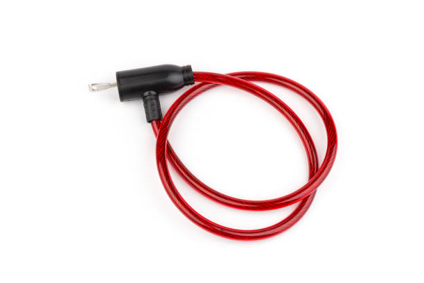 istock Flexible red bicycle cable with key on white background.  Security and safety concept. 1286307734