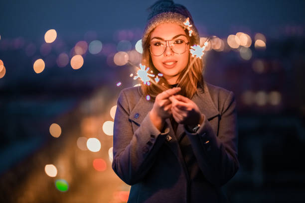 istock Beautiful girl holding christmas sparkler 1286308452