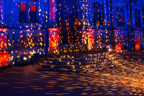 Christmas lights reflected at the facade . Paris City Hall in the Christmas night