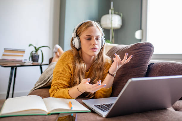 istock Young woman studying with laptop at home 1286310001