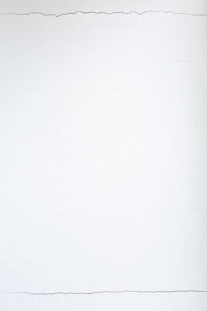 istock White cracked paint. Abstract background of white peeling paint 1286312769