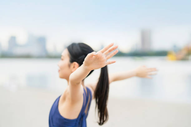 istock Young woman stretching and taking a deep breath 1286312919