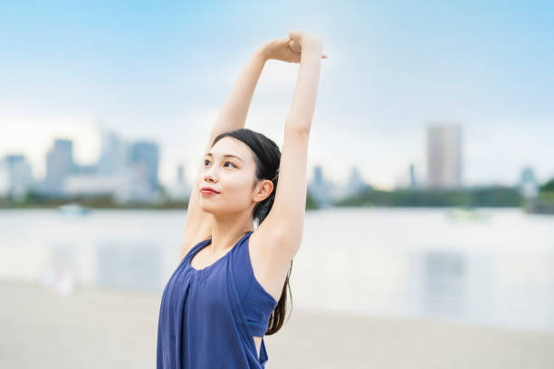 istock Young woman stretching and taking a deep breath 1286312953