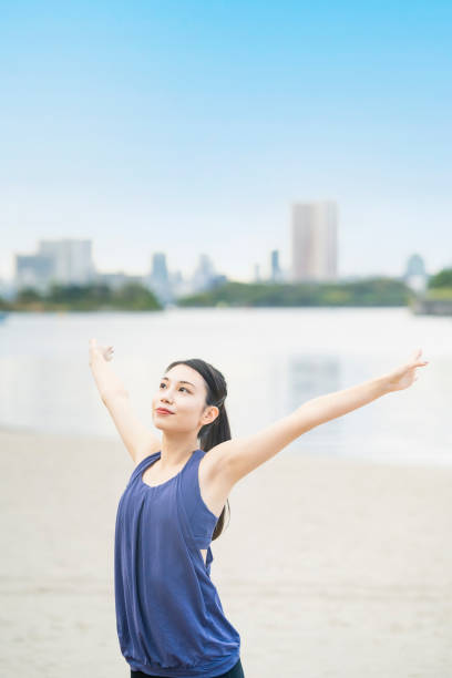 istock Young woman stretching and taking a deep breath 1286312973
