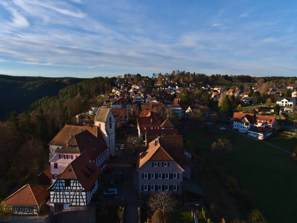 beautiful panorama view over small village zavelstein located in the north of low mountain range black forest in the evening light in autumn. - black forest forest sky blue imagens e fotografias de stock