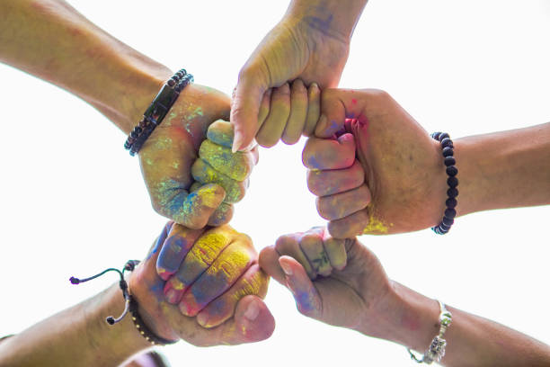 istock friends hands close up in holi paint 1286315882