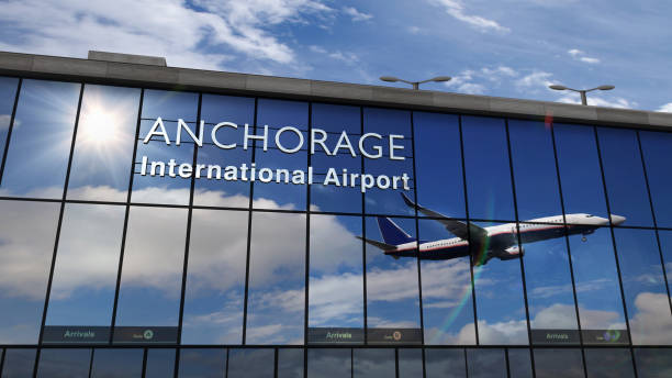 istock Airplane landing at Anchorage mirrored in terminal 1286316780