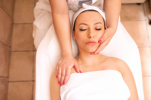 istock Gentle hands of a masseuse massaging her client 1286317564