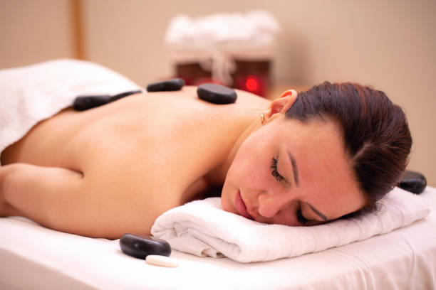istock Woman lying on the table in spa and relaxing 1286317869