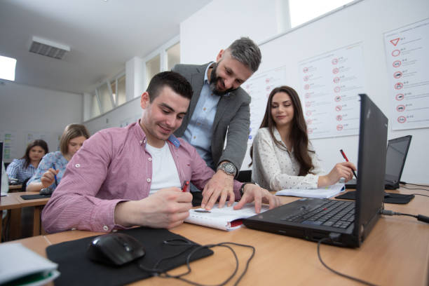 istock Driving teacher introducing government-printed driving handbooks and manuals 1286320952