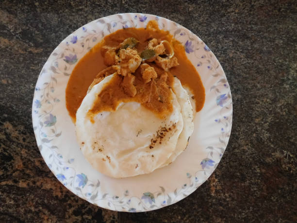 Kerala style delicious dish ( Rice rotti with Chicken curry) in a bowl