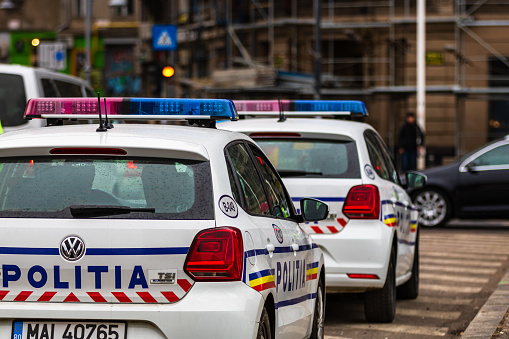 Back view of romanian police cars (Politia Rutiera) in downtown Bucharest, Romania, 2020