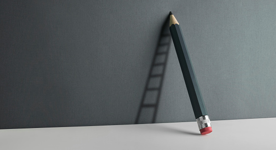 A pencil leaning against the wall. Ladder shade reflect on the wall.
Copy space for your text.