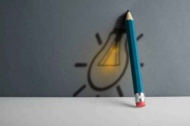 Pencil tip standing out from croud of pencil rubber erasers with empty thought bubble