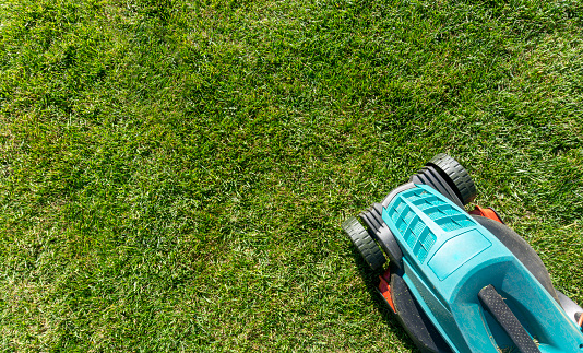 self-propelled lawn mower with hose connection for cleaning the deck.